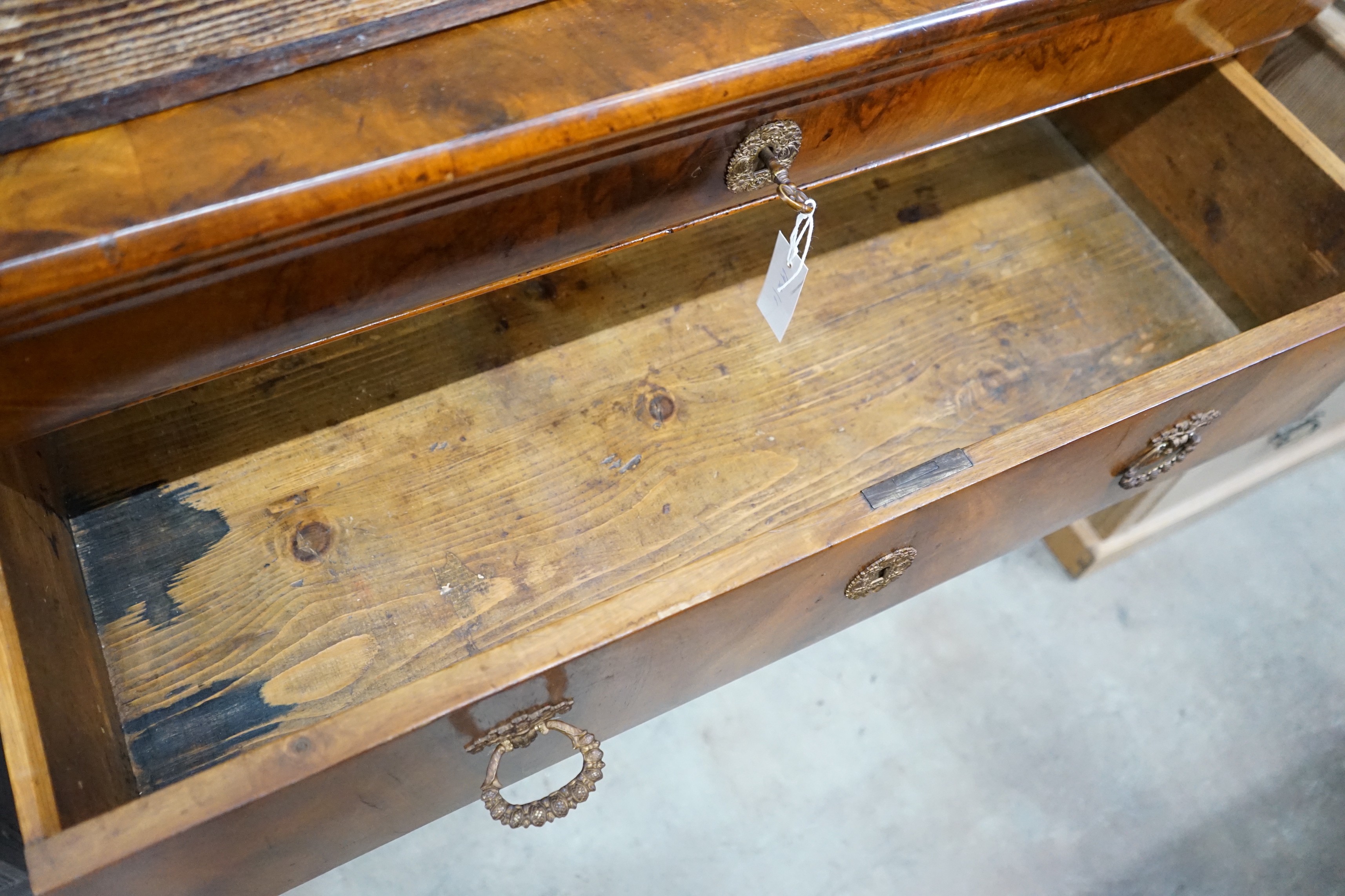 A French Second Empire figured walnut commode, fitted with four long guilt metal mounted drawers, 123 cm wide, 103 cm high, 62 cm deep